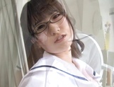 Schoolgirl with glasses gives a sensual striptease picture 13