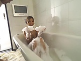 Adorable Aika Soggy licks erotically in a bathtub