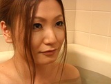 Naked Japanese housewife Harukaze Emi blows a cock in the bath