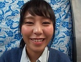 Pretty Asian babe smiles as she sucks a cock picture 25