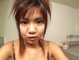 Appetizing Japanese teen doll shows off with a hot titfuck picture 3