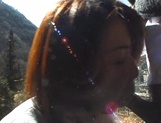 Kayoko Uesugi, mature Asian babe gives outdoor blowjob picture 15