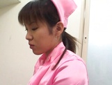 Sexy Asian nurse in pink stimulates her patient with her mouth picture 68