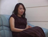 Big-tittied Asian lady in nylon pantyhose masturbates her pussy