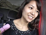 Brunette Japanese MILF gets pussy toyed in a van