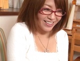 Japanese MILF with glasses deepthroats a cock and grinds on it well
