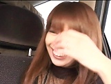 Long-haired Japanese MILF spreads legs to get toyed in the car
