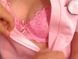 Erika Kurisu Asian nurse shows off big tits in pink lingerie