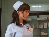 Crazy nurse Minami Kojima gives a hand job and rides cock picture 3