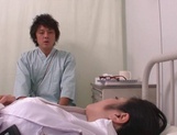 Busty Japanese Minako Komukai nurse plays with a big cock picture 1