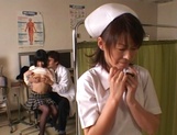 Young Asian babe Ai Himeno gets her tits played with by the doc picture 33