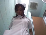 Voluptuous Japanese nurse plays with pussy in the toilet picture 37
