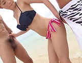 Young bikini babe, Rino Kirishima sucks two dicks on the beach picture 11