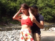 Naughty Japanese teen exposes tiny tits in outdoor drilling