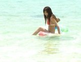 Rio Fujisaki Lovely Asian teen gives a hot blowjob on the beach