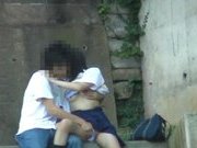 Asian sweetie and her guy having sex on the steps outside