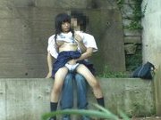 Asian sweetie and her guy having sex on the steps outside