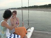 Japanese wife sucking cock on the deck of boat