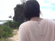 Busty Asian milf Kazari Hanasaki sucks schlong on a beach
