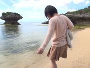 Busty Asian milf Kazari Hanasaki sucks schlong on a beach