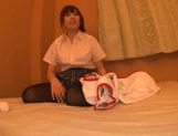 Sweet Japanese teen is having fun with sex toy picture 13