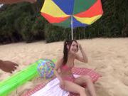 Arousing Japanese AV Model on the beach in her mini bikini