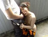 Young Japanese hottie sucks off a wanker in the outdoors picture 10
