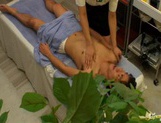 Sexy Japanese massage lady jerks off dick and gets banged from behind