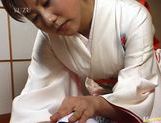 Kimono clad Japanese MILF Megumi Tsuchida wanks off a dick