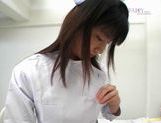 Sexy nurse Saki Budou gives a quick handjob to her male patient picture 14