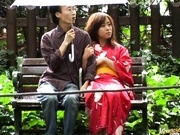 Asian babe in kimono enjoys the outdoors