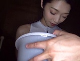 Alluring Asian teen Kanae Renon gives a handwork and sucks a cock picture 11