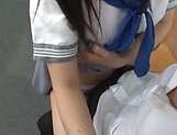 Cute Japanese schoolgirl loves giving a handjob picture 8