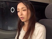 Alluring Asian milf gets persuaded to have some steamy car sex