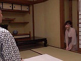 Woman in a kimono is sucking a hard dick