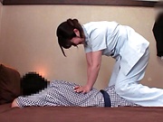 Japanese mature is giving a dick massage