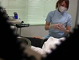 Hot Japanese nurse blows a cock and gives a handjob in her office picture 12
