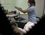 Hot Japanese nurse blows a cock and gives a handjob in her office picture 13