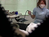 Hot Japanese nurse blows a cock and gives a handjob in her office picture 15