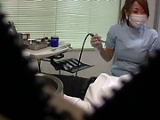 Hot Japanese nurse blows a cock and gives a handjob in her office