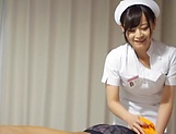 Super luscious Japanese nurse massages a cock and bounces on it hard