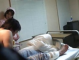Crazy Japanese nurse seduces a guy in a ward giving a handjob picture 4