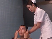 Smoking hot Japanese nurse fucks with a guy in the bath