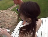 Pretty Asian babe getting bonked outdoors
