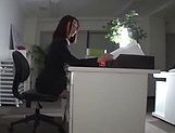Horny woman is masturbating at work