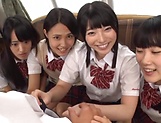 Several Asian babes sharing a massive dick