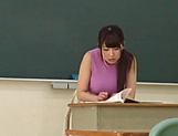 Spoiled Japanese teacher Kirishima Sakura fucks in the classroom picture 3