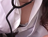 Asian nurse in a black pantyhose giving a sexual treatment to her patient