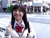 Smiling Japanese schoolgirl sucks a dildo and a real cock