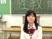 Smiling Japanese schoolgirl sucks a dildo and a real cock